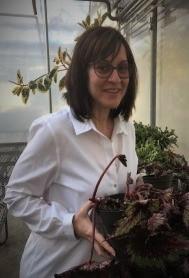 Teaching Award Recipient Jessica Gemella in a greenhouse
