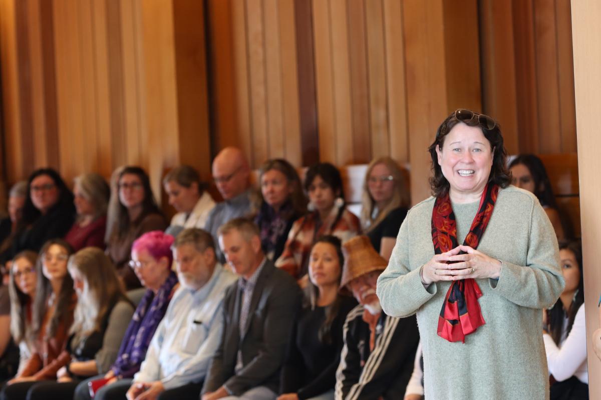 President Saucier speaks with a crowd of people behind her