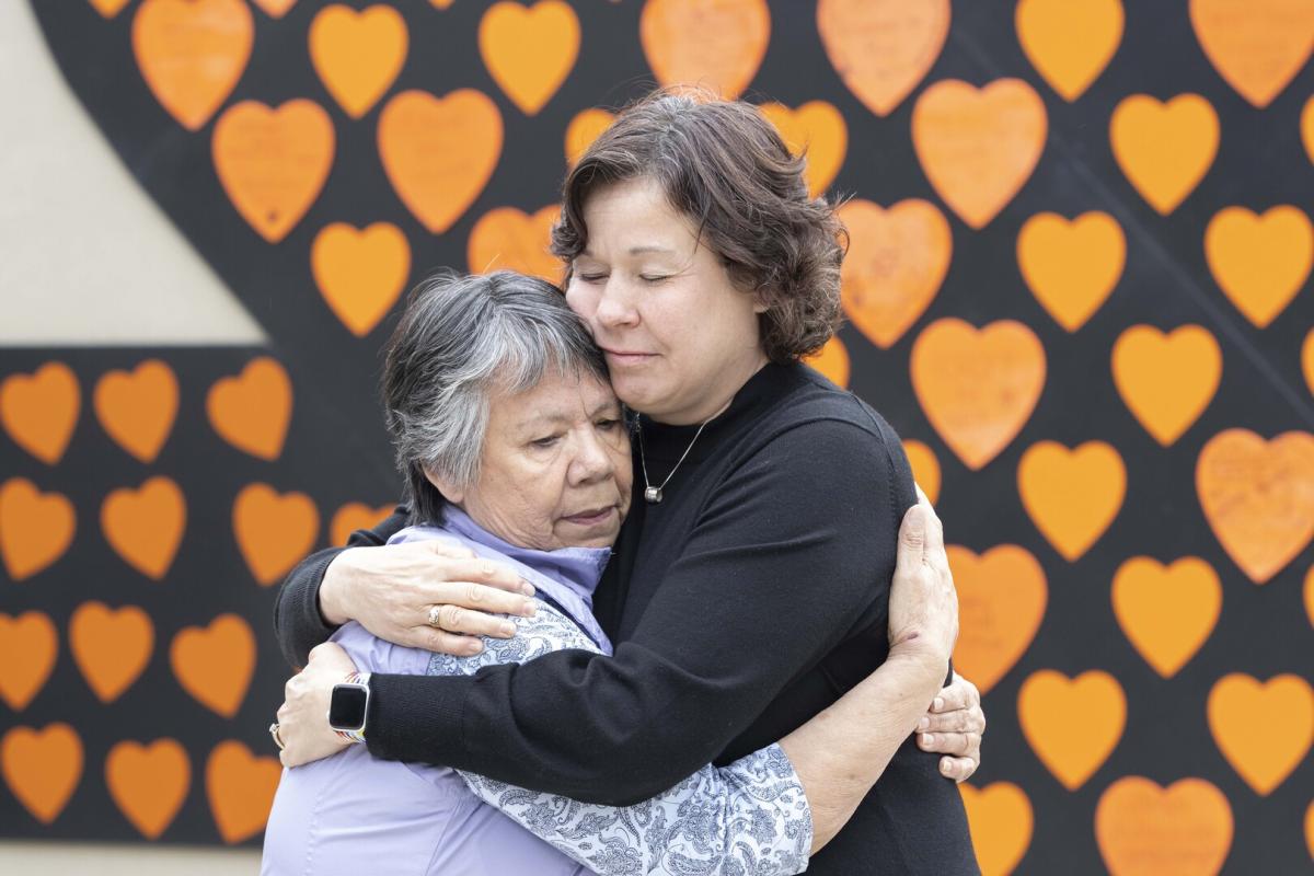 VIU President Dr. Deborah Saucier hugs VIU Elder-in-Residence Geraldine Manson